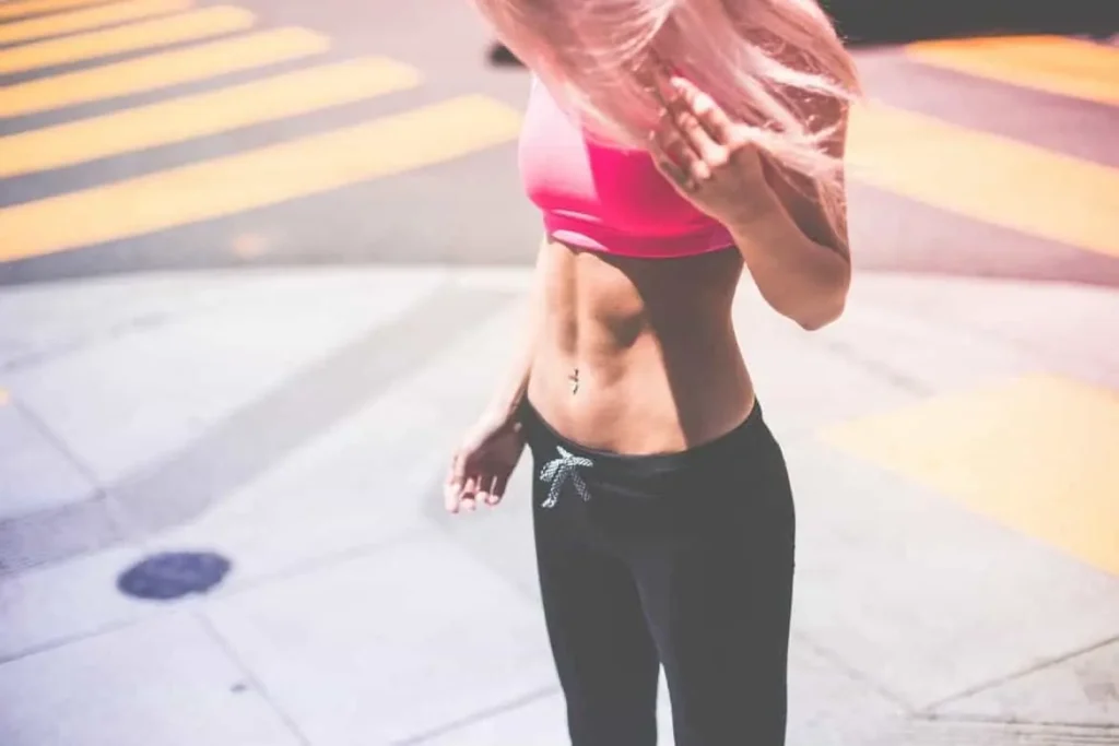 Woman with toned stomach after LA-EMS Body Sculpting Treatment Surrey