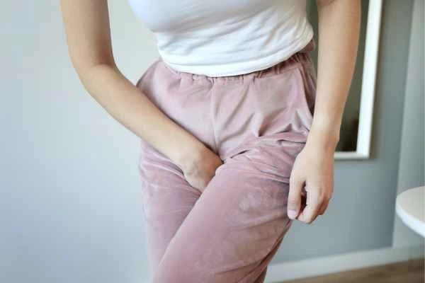 woman running for the toilet because of urinary incontinence Surrey
